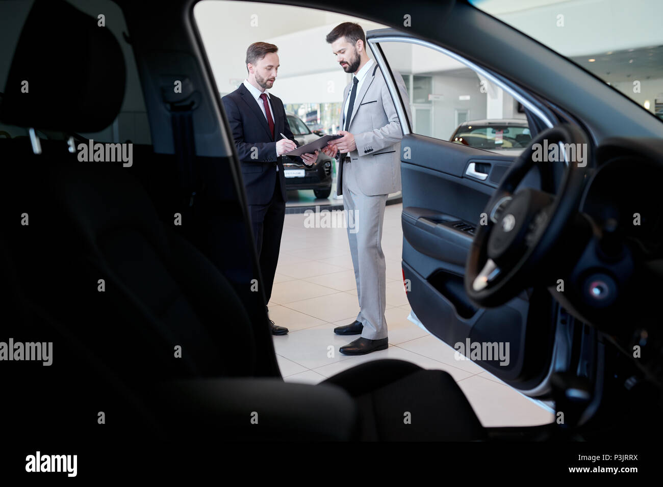 Car Salesman Talking to Client Stock Photo Alamy