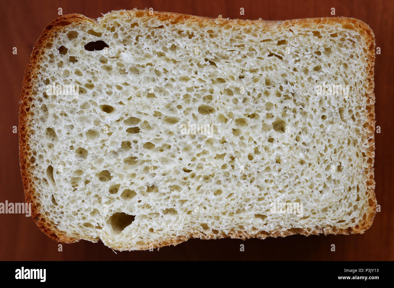 White bread texture in a cut. Close-up view on the plane of the finished dough product Stock Photo