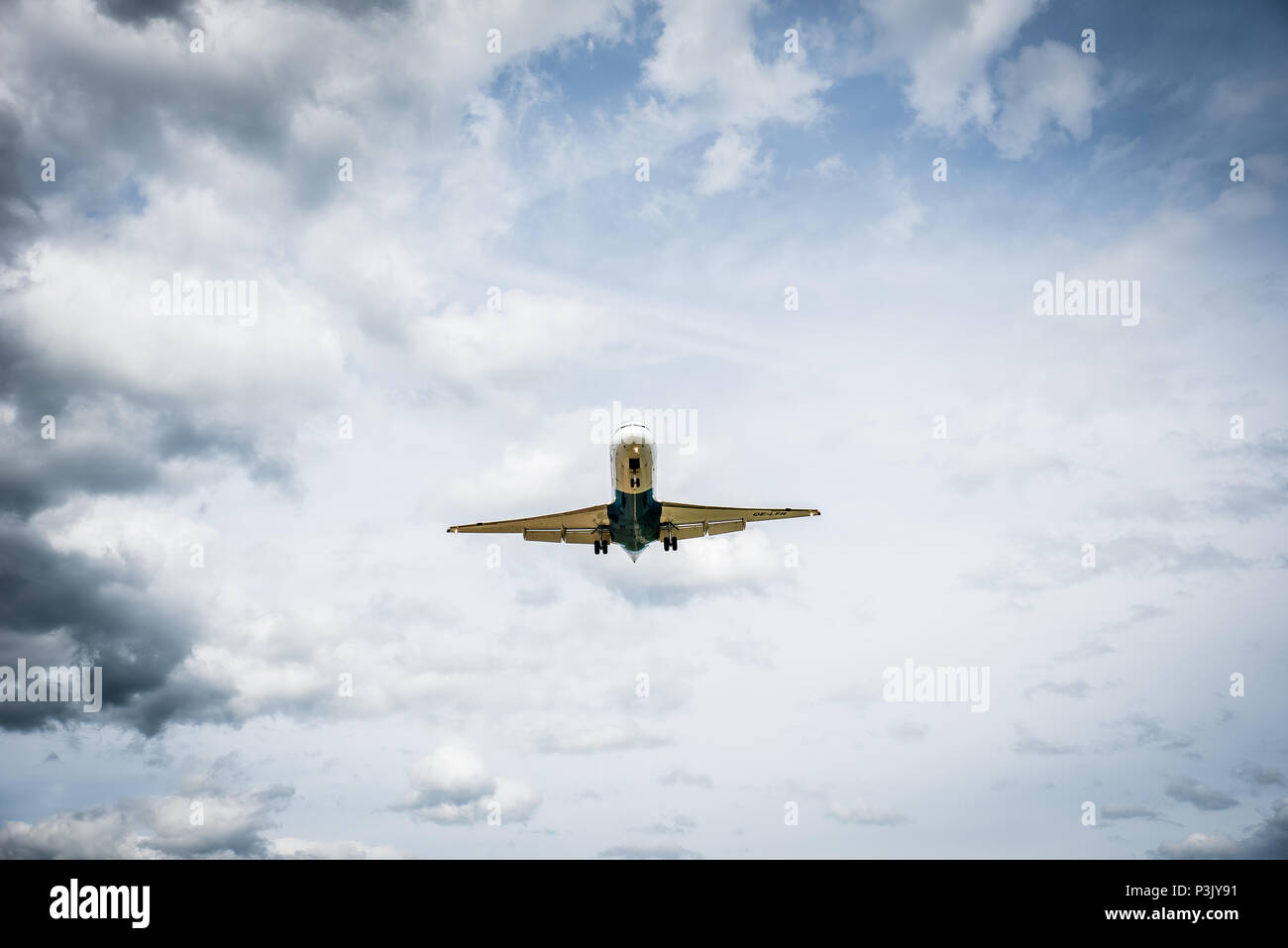 Airplane flying in dark clouds hi-res stock photography and images - Alamy