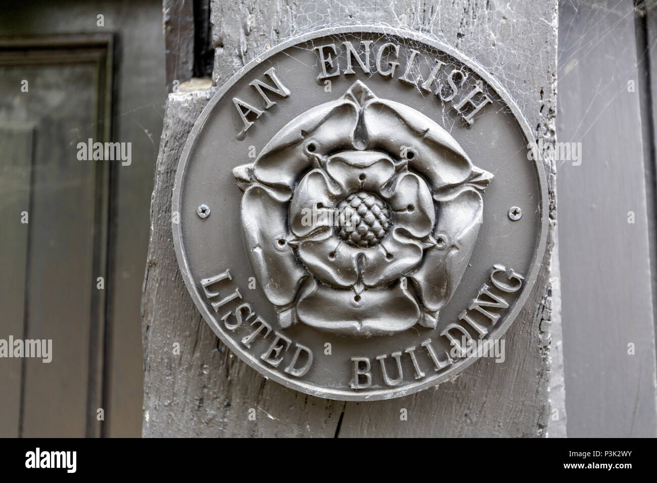 An English Listed Building Cast Lead Plaque In Mermaid Street Showing Typically Steep Slope And Cobbled Surface Rye East Sussex England Uk Stock Photo Alamy