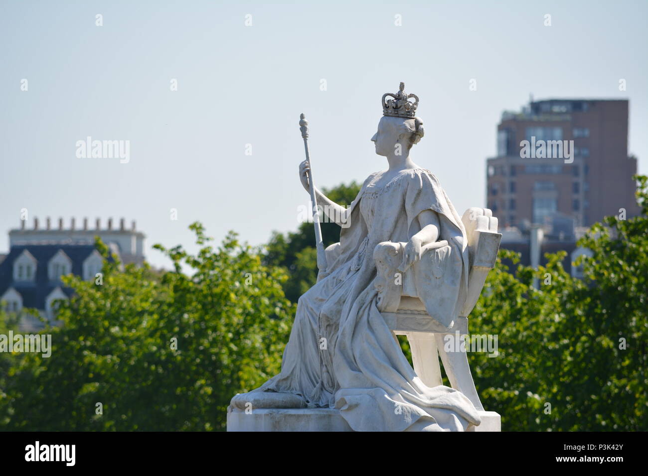 A statue of Queen Victoria in front of Kensington Palace in Kensington Gardens, City of