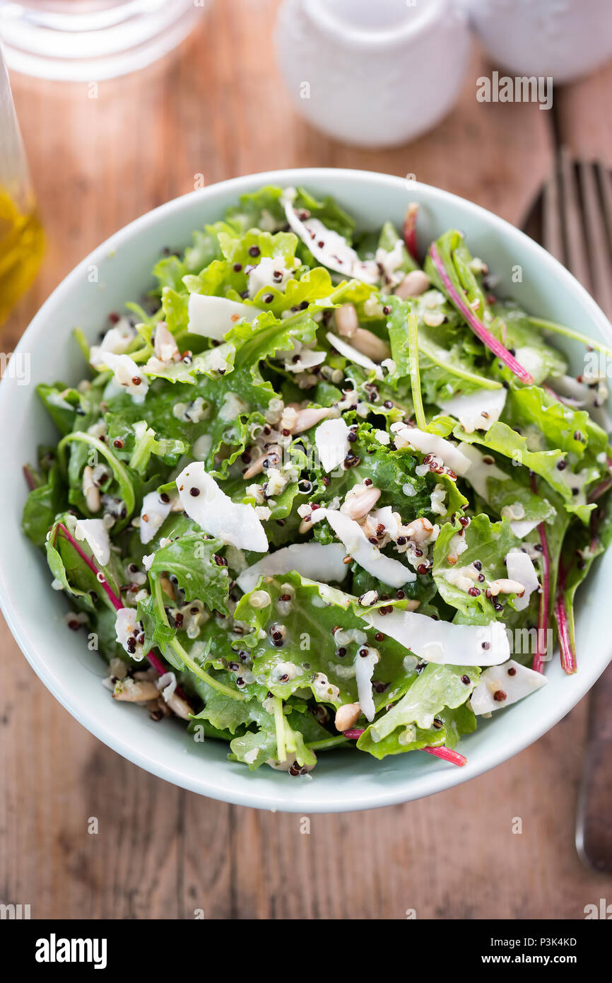 Quinoa & baby kale salad with sunflower seeds, shredded coconut, mixed