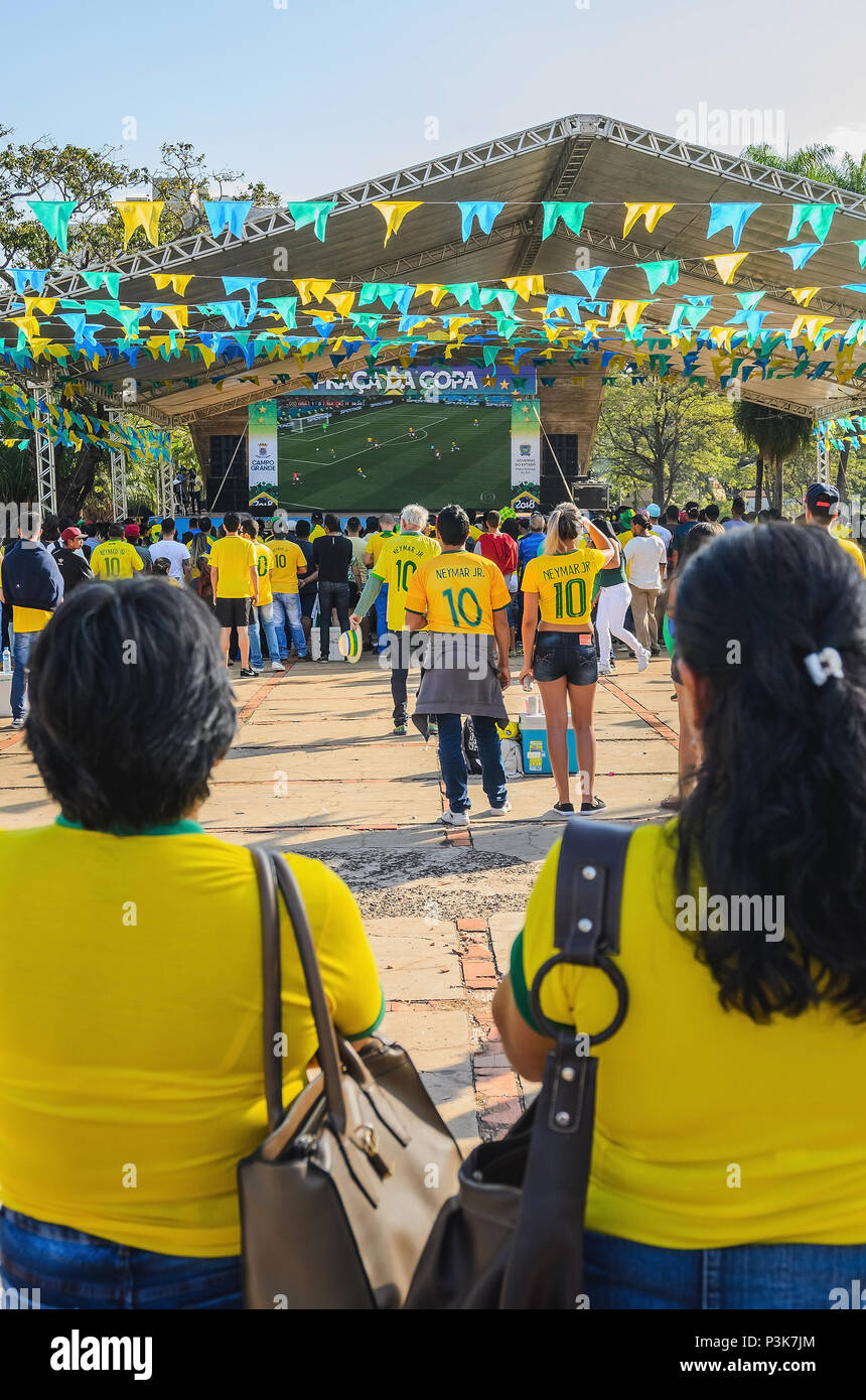 Campo Grande, Brazil - June 17, 2018: Brazilians fans of the soccer team (Seleção Brasileira de Futebol) at Praça do Radio Clube to watch the match be Stock Photo
