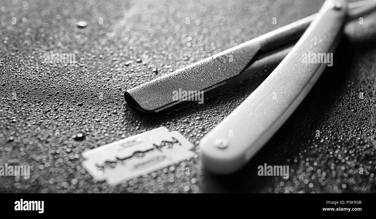 Unsafe Razorblade Brutal treatment Black and White Stock Photos & Images - Alamy