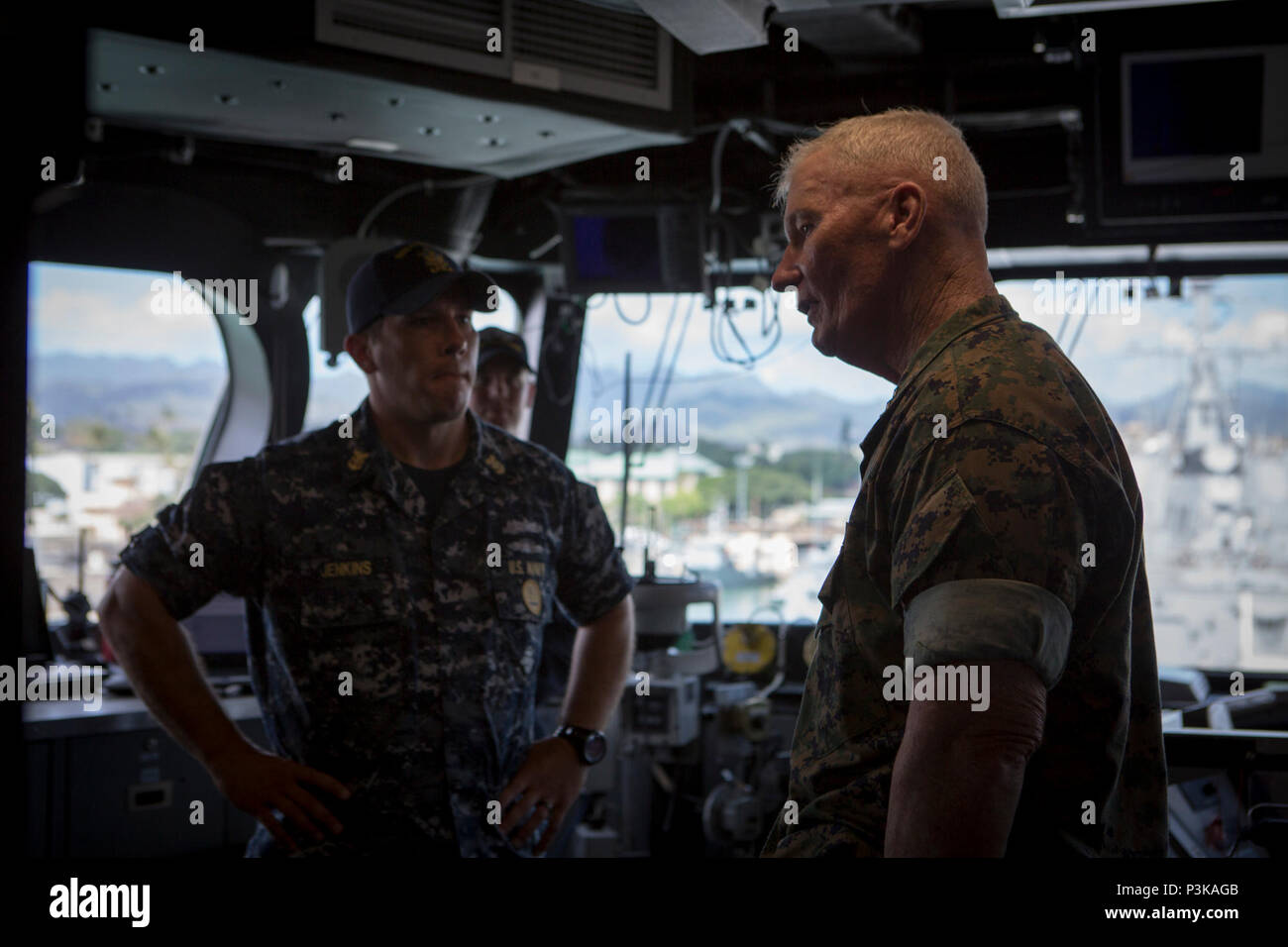 160708-M-QQ799-151 JOINT BASE PEARL HARBOR-HICKAM (July 8, 2016) Lt. Gen. John A. Toolan, U.S. Marine Corps Forces, Pacific commander, speaks with Command Master Chief Lucas Jenkins, USS Coronado, on a visit to the ship during Exercise Rim of the Pacific 2016. Twenty-six nations, 49 ships, six submarines, about 200 aircraft, and 25,000 personnel are participating in RIMPAC from June 29 to Aug. 4 in and around the Hawaiian Islands and Southern California. The world’s largest international maritime exercise, RIMPAC provides a unique training opportunity while fostering and sustaining cooperative Stock Photo