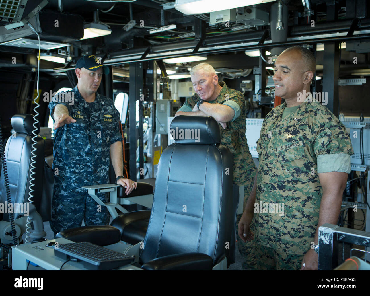 160708-M-QQ799-116 JOINT BASE PEARL HARBOR-HICKAM (July 8, 2016) Cdr. Scott Larson, commanding officer, USS Coronado, speaks with Lt. Gen. John A. Toolan, U.S. Marine Corps Forces, Pacific commander and Brig. Gen. Brian Cavanaugh, MARFORPAC deputy commander, on a visit to the ship during Exercise Rim of the Pacific 2016. Twenty-six nations, 49 ships, six submarines, about 200 aircraft, and 25,000 personnel are participating in RIMPAC from June 29 to Aug. 4 in and around the Hawaiian Islands and Southern California. The world’s largest international maritime exercise, RIMPAC provides a unique t Stock Photo