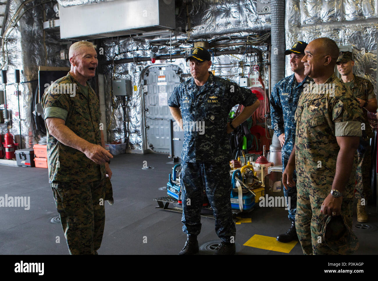 160708-M-QQ799-055 JOINT BASE PEARL HARBOR-HICKAM (July 8, 2016) Lt. Gen. John A. Toolan, U.S. Marine Corps Forces, Pacific commander, visits USS Coronado during Exercise Rim of the Pacific 2016. Twenty-six nations, 49 ships, six submarines, about 200 aircraft, and 25,000 personnel are participating in RIMPAC from June 29 to Aug. 4 in and around the Hawaiian Islands and Southern California. The world’s largest international maritime exercise, RIMPAC provides a unique training opportunity while fostering and sustaining cooperative relationships between participants critical to ensuring the safe Stock Photo