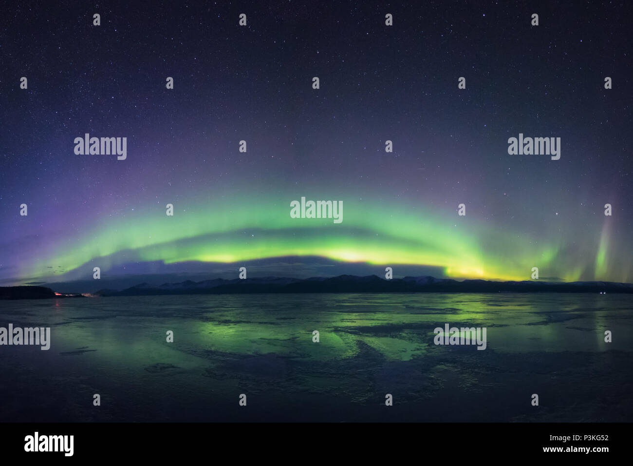 Aurora northern lights over frozen lake Yukon Canada Stock Photo