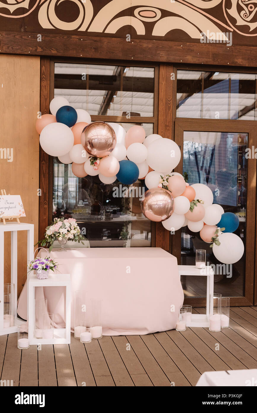 Wedding candy bar decorated with balloons Stock Photo - Alamy