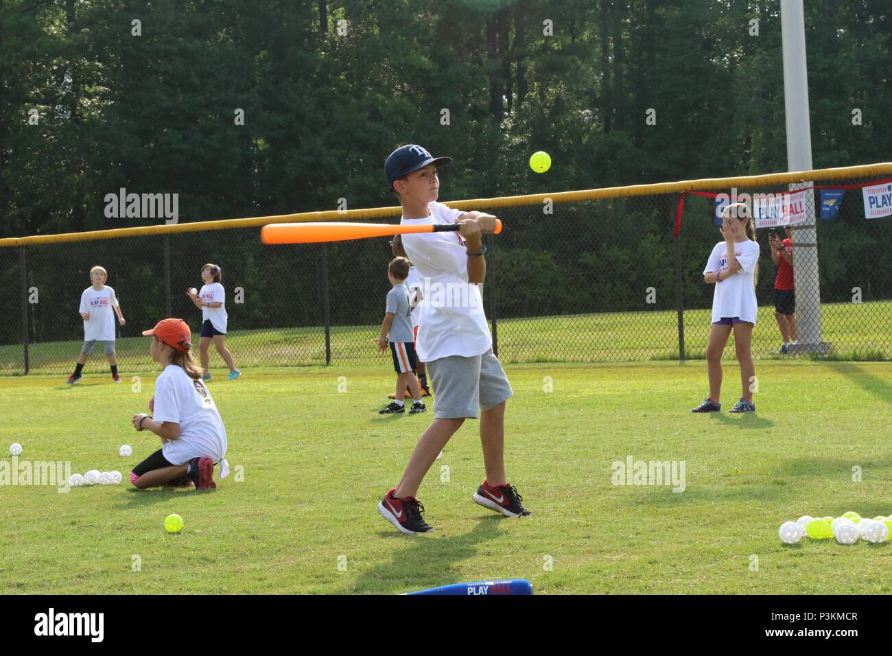 A young baseball fan takes his base while participating in a friendly  pick-up game with other kids during the MLB PLAY BALL event at Fort Bragg,  N.C., July 2, 2016. PLAY BALL