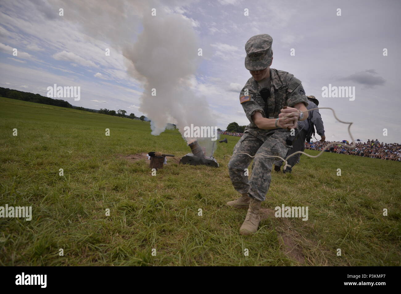 GETTYSBURG, PA - Private First Class Marina Eberhart, a Combat Medic with the 865th Army Combat Support Hospital, Ashley Detatchment, pulls the handle on a Civil War-era mortar during a demonstration at the 153rd anniversary of the Battle of Gettysburg on July 3rd, 2016.    The Battle of Gettysburg took place over three days, from July 1–3, 1863, in and around the town of Gettysburg, Pennsylvania. The battle was described as the turning point of the Civil Warm and involved the largest number of casualties of the conflict, ending with over 23,000 casualties on the Union side, and an estimated s Stock Photo