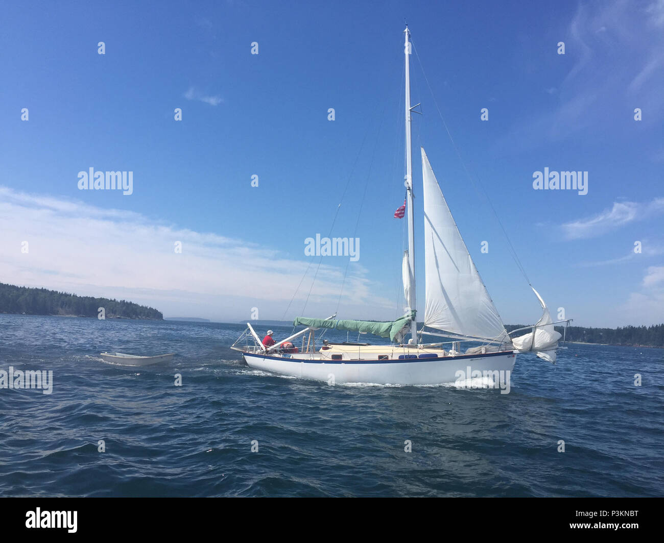 Crewmembers from Coast Guard Station Rockland, Maine, are aboard the sailboat, Ingomar, after