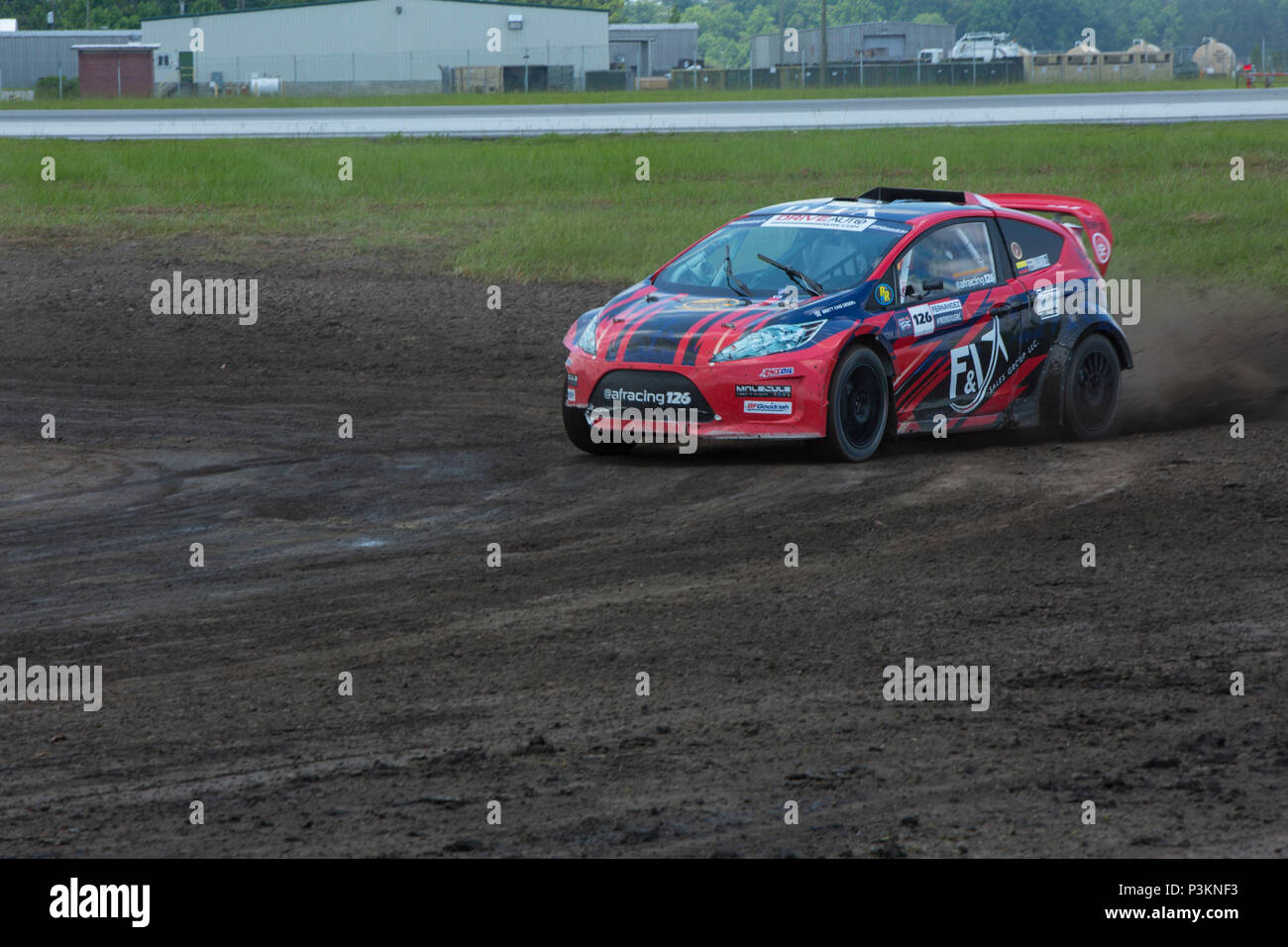 Alejandro Fernandez, a driver with AF racing team, accelerates around a corner, Marine Corps Air Station New River, N.C., July 2, 2016. The world's best rallycross drivers are competing at MCAS New River for the second season in a row for a doubleheader July 2-3, 2016, featuring an all-new course layout, bringing the track even closer to the fans. (U.S. Marine Corps photo by Lance Cpl. Austin M. Livingston MCIEAST Combat Camera/Released) Stock Photo