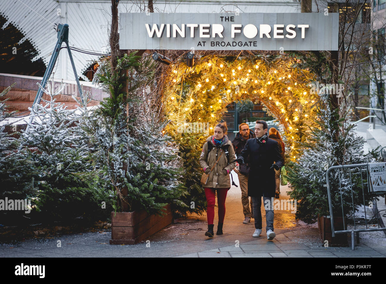 London, UK - November 2017. People in Exchange Square in Broadgate, where a Nordic-inspired forest called Winter Forest is installed at Christmas. Stock Photo