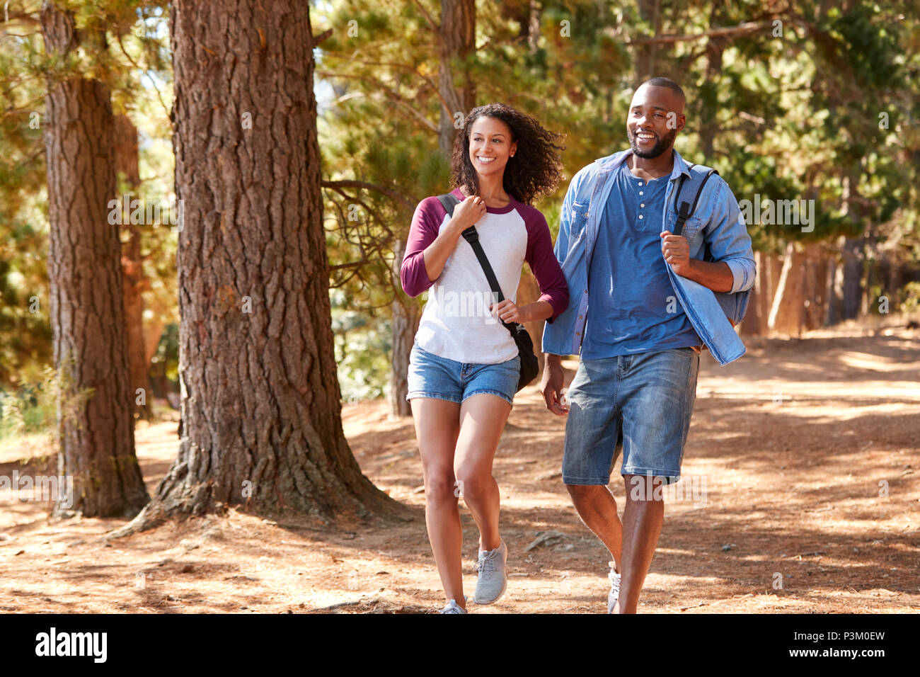 Couple On Hiking Adventure In Wooded Countryside Stock Photo