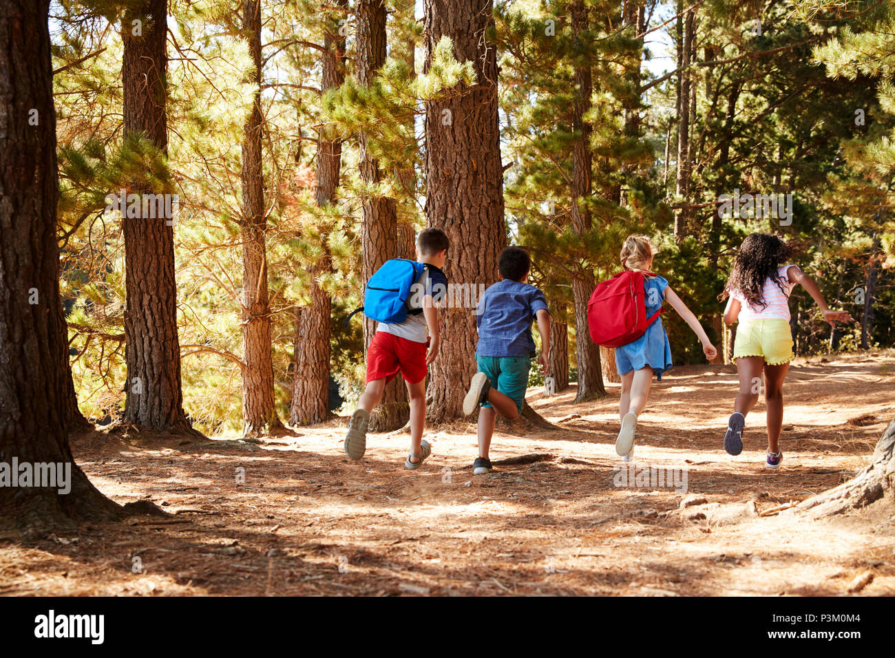Rear view children running hi-res stock photography and images - Alamy