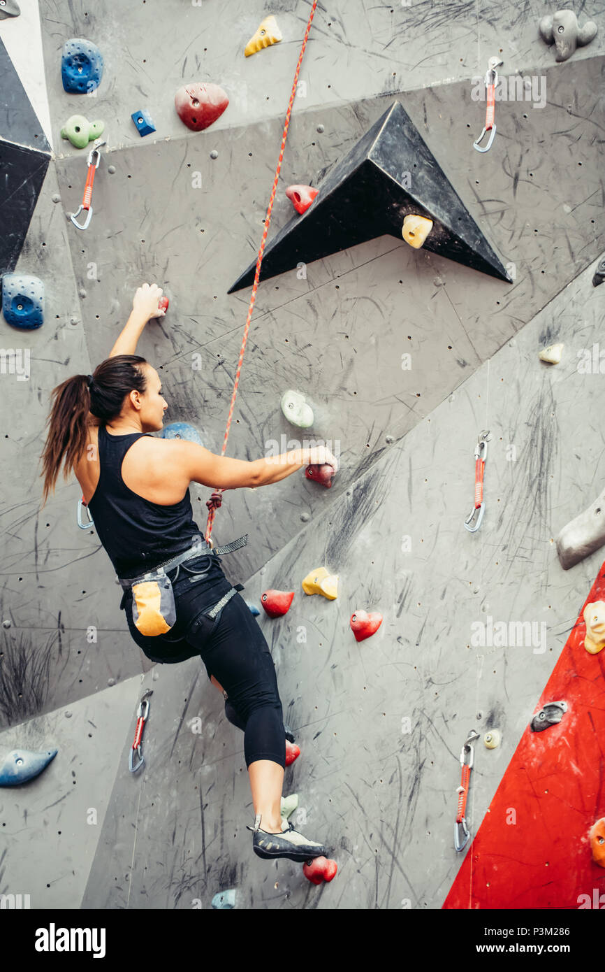 sporty woman in boulder climbing hall Stock Photo Alamy