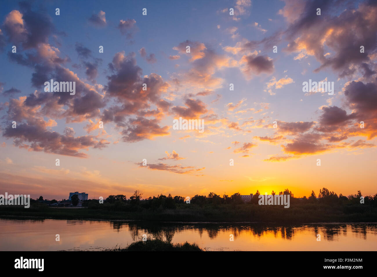 River landscape during sunset over the horizon beautiful cloudy sky ...