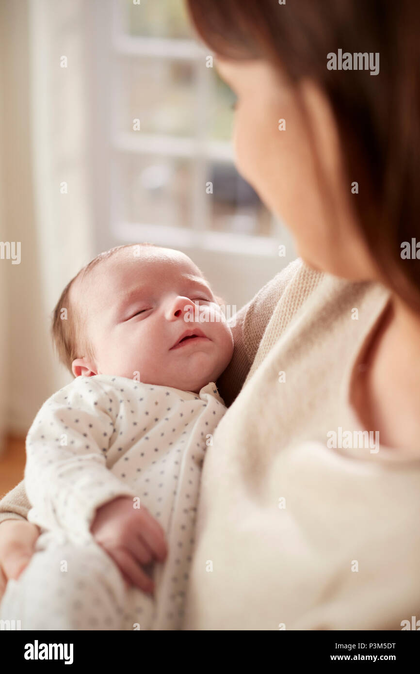 Newborn baby being held up vertical hires stock photography and images