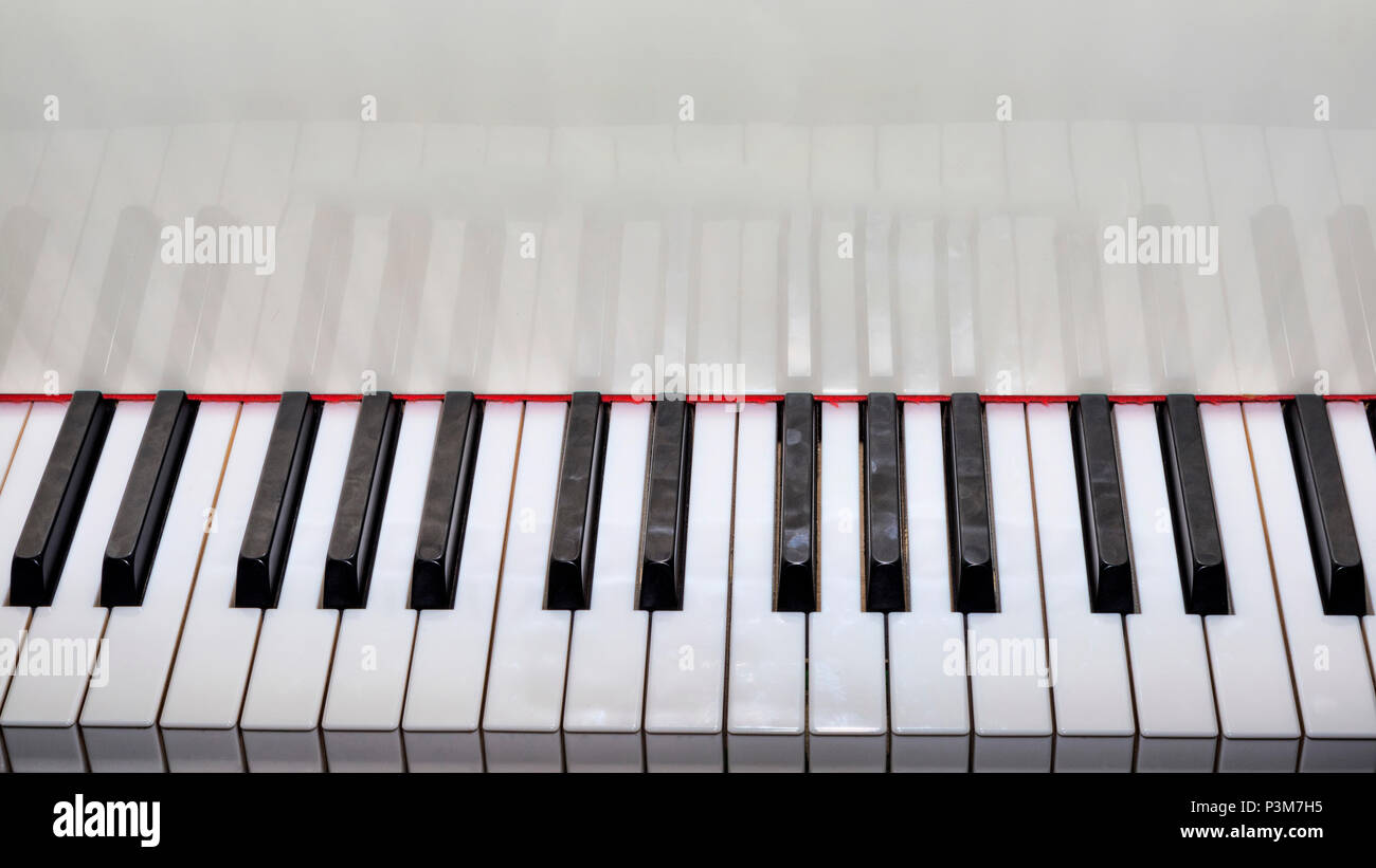 Close Up view of a grand piano white keyboard Stock Photo