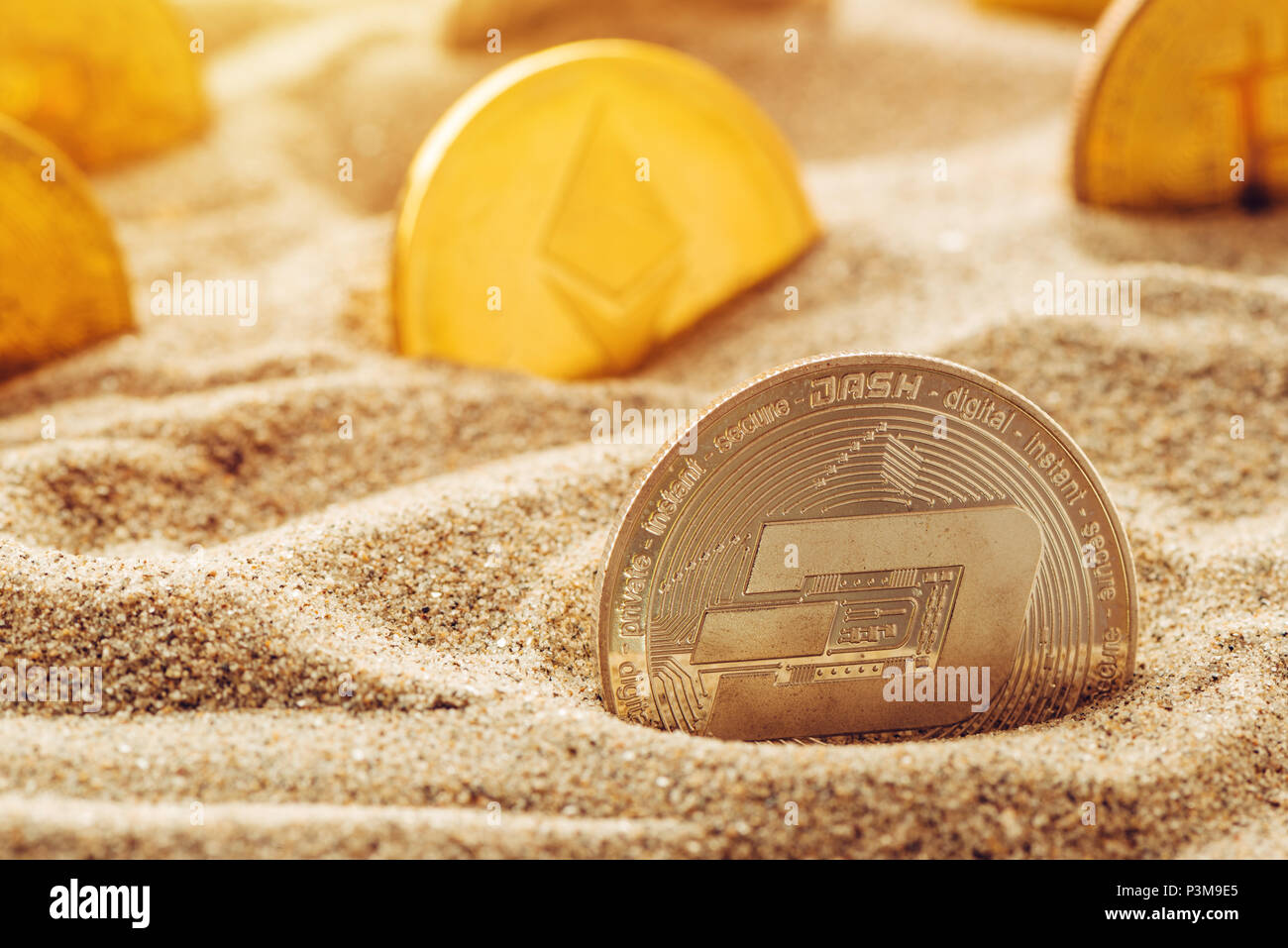 Silver Dash coin in sand, conceptual image for lost and found valuable cryptocurrency  coins that are standing the test of time Stock Photo - Alamy