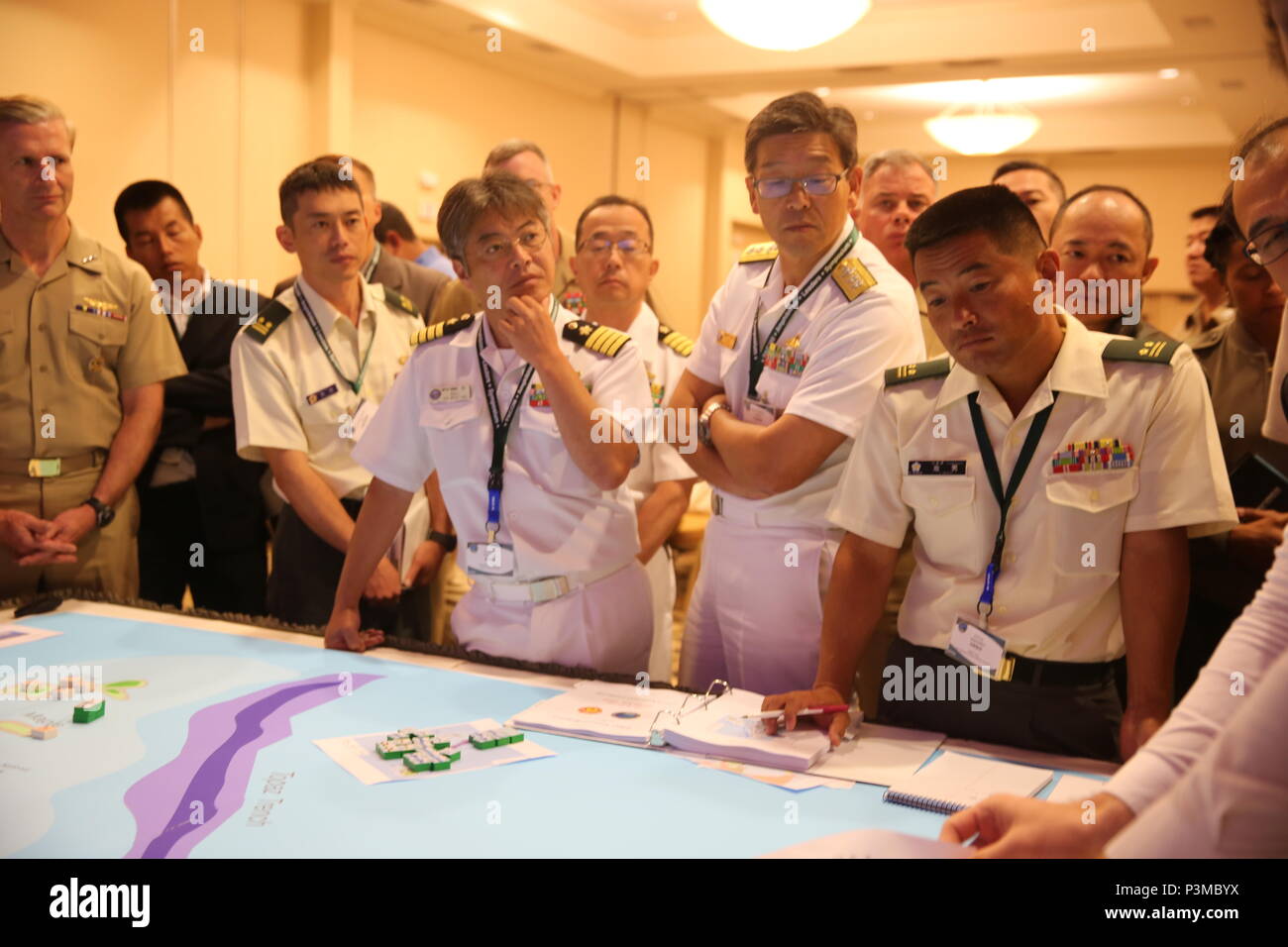 SAN DIEGO Calif. - Service members with Japan and the United States observe strategies presented during a Table-Top Exercise, as part of Pacific Command Amphibious Leaders Symposium 2016 (PALS-16) in San Diego, Calif., July 12, 2016. PALS-16 brings together senior leaders of allied and partner nations throughout the Indo-Asia Pacific region. The symposium consists of academic and group discussions, a Table-Top Exercise, a sea-basing and amphibious landing demonstration. (U.S. Marine Corps photo by Cpl. Demetrius Morgan/ RELEASED) Stock Photo