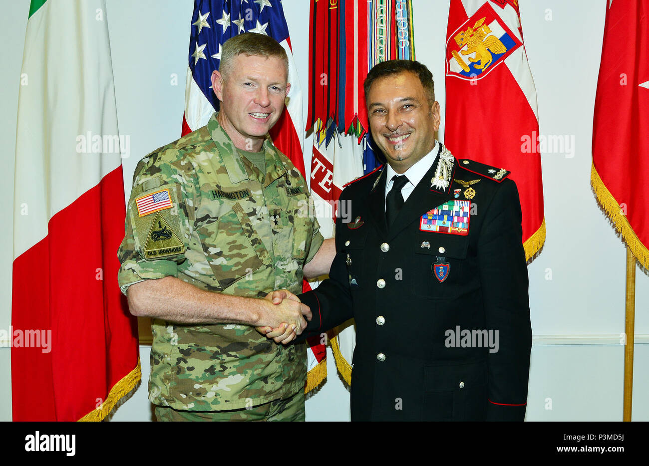 From left, Maj. Gen. Joseph P. Harrington, U.S. Army Africa Commanding General, and Brig. Gen. Giovanni Pietro Barbano, the new Director of the Center of Excellence for Stability Police Units (COESPU); pose for a photograph in the USARAF commander's office during a recent visit to Caserma Ederle, Vicenza, Italy July 12, 2016. (Photo by U.S. Army Visual Information Specialist Davide Dalla Massara/Released) Stock Photo