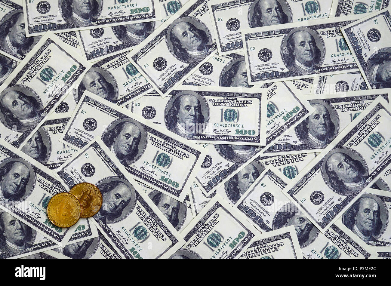 Golden bitcoins lie on a lot of dollar bills. The concept of raising the  price of bitcoin relative to the US dollar Stock Photo - Alamy