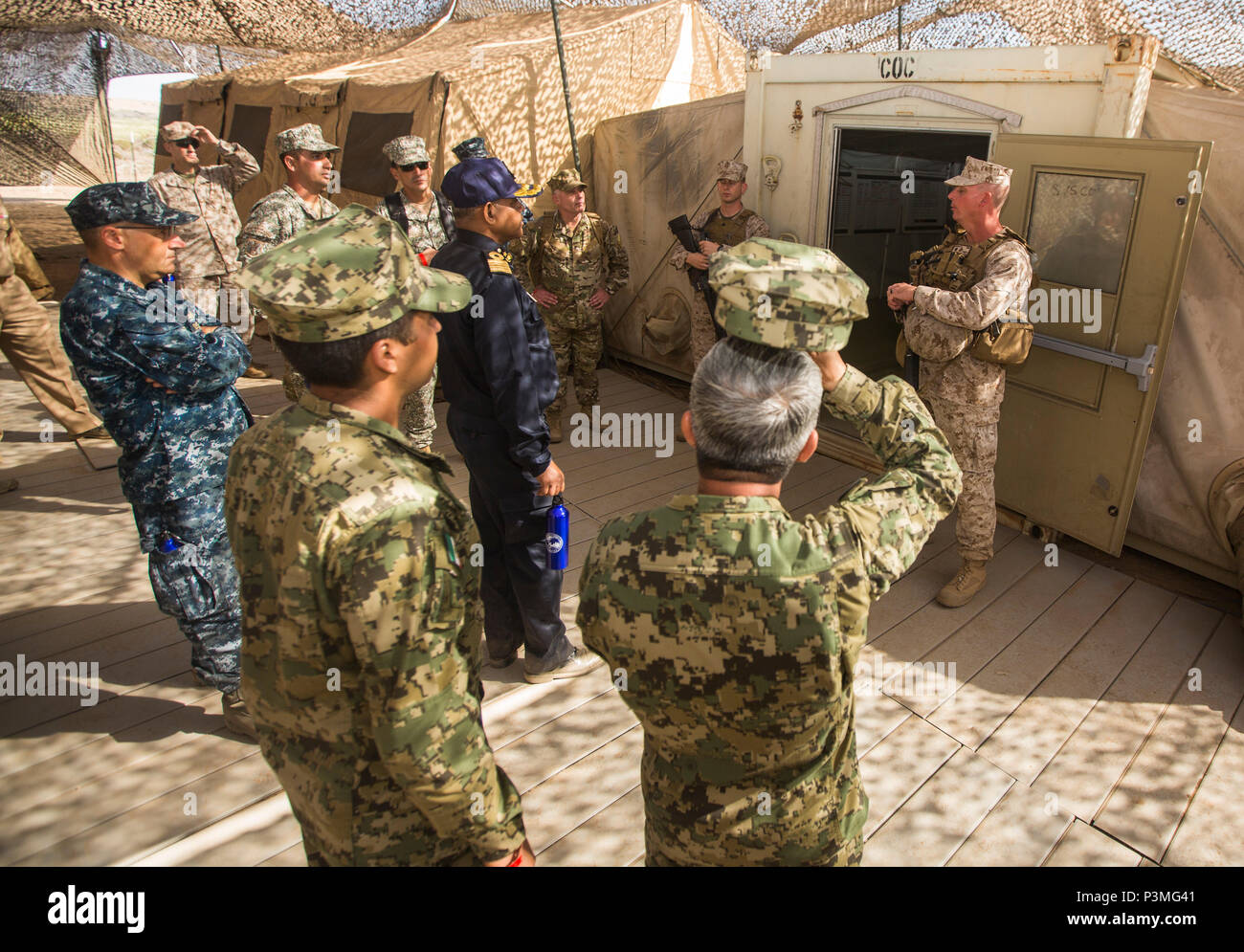 U.S. Marine Corps Lt. Col. Bill Brown, back-right, commanding officer of 1st Transportation Support Battalion, 1st Marine Logistics Group, discusses the capabilities of the Command Operations Center during the USPACOM Amphibious Leaders Symposium (PALS) on Camp Pendleton, Calif., July 13, 2016. PALS brings together senior leaders of allied and partner nations from the Indo-Asia-Pacific region to discuss key aspects of maritime/amphibious operations, capability development, crisis response, and interoperability. Twenty-two allied and partnered nations, including the U.S. are participating. (U.S Stock Photo