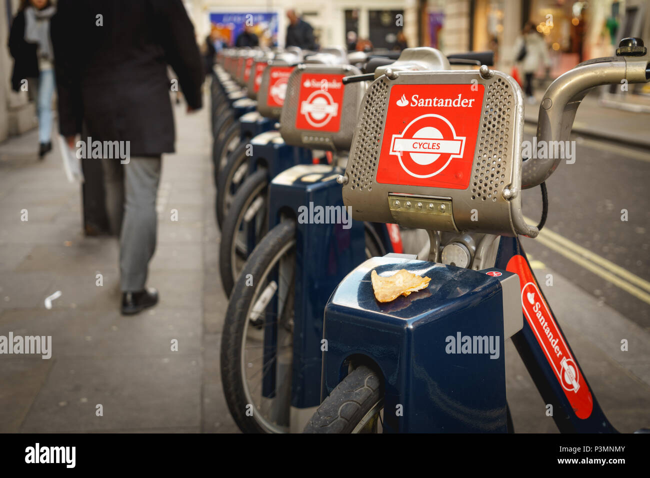 London, UK - November 2017. Santander Cycles bikes, also known as Boris bikes, in a docking station near Oxford Circus. Landscape format. Stock Photo