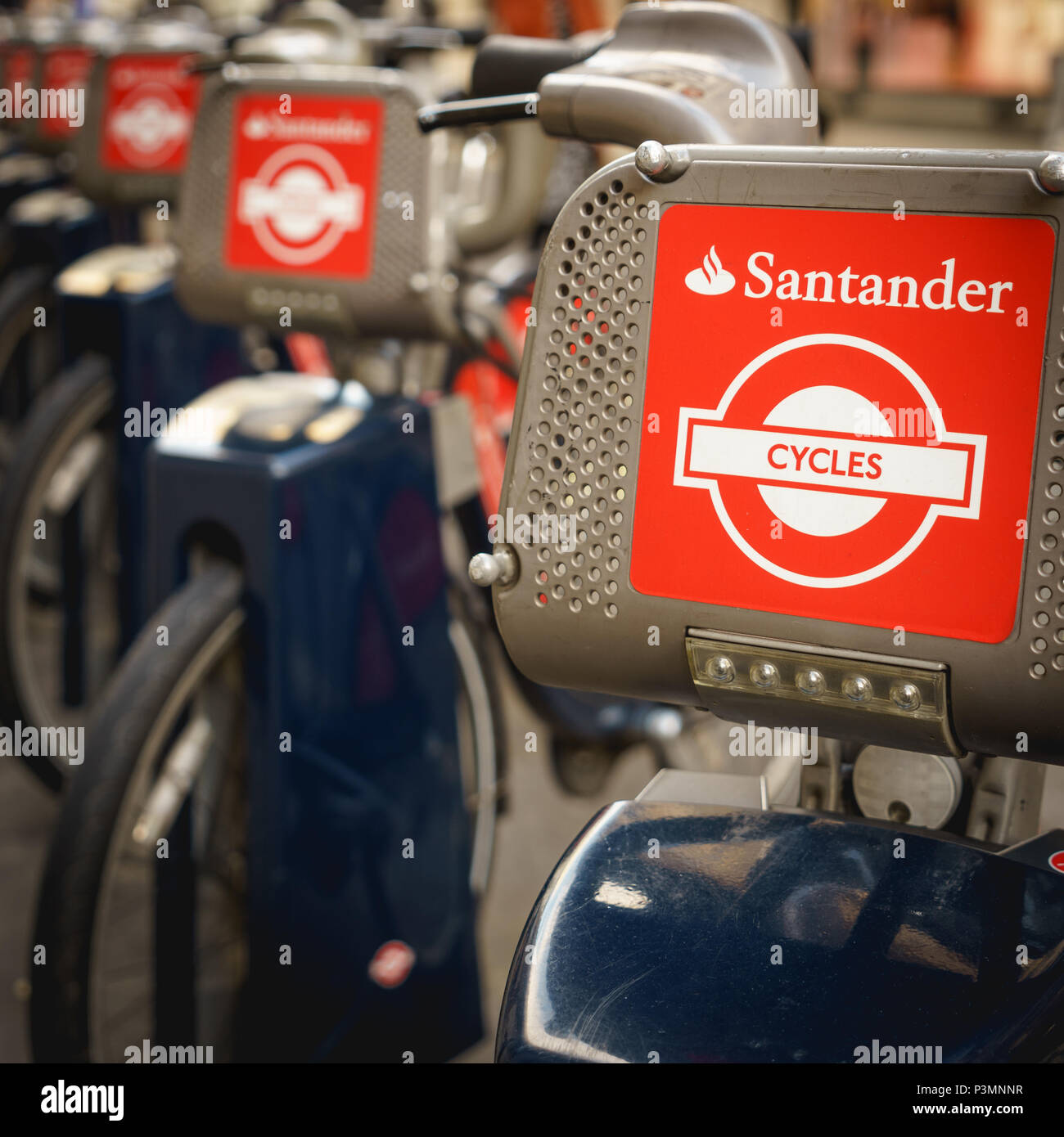 London, UK - November 2017. Santander Cycles bikes, also known as Boris bikes, in a docking station near Oxford Circus. Square format. Stock Photo