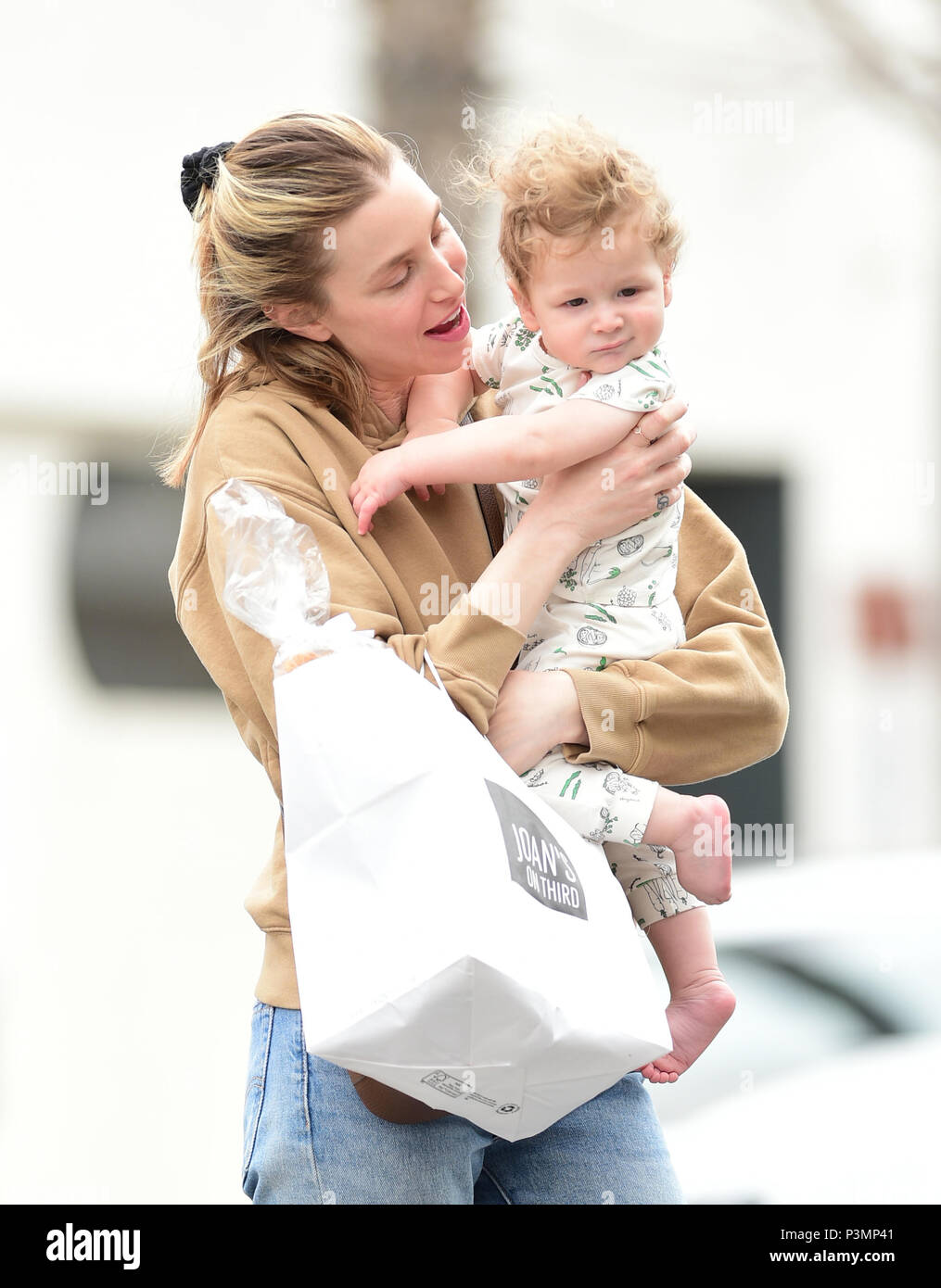 Whitney Port greets her son Sonny after picking up lunch at Joan's on
