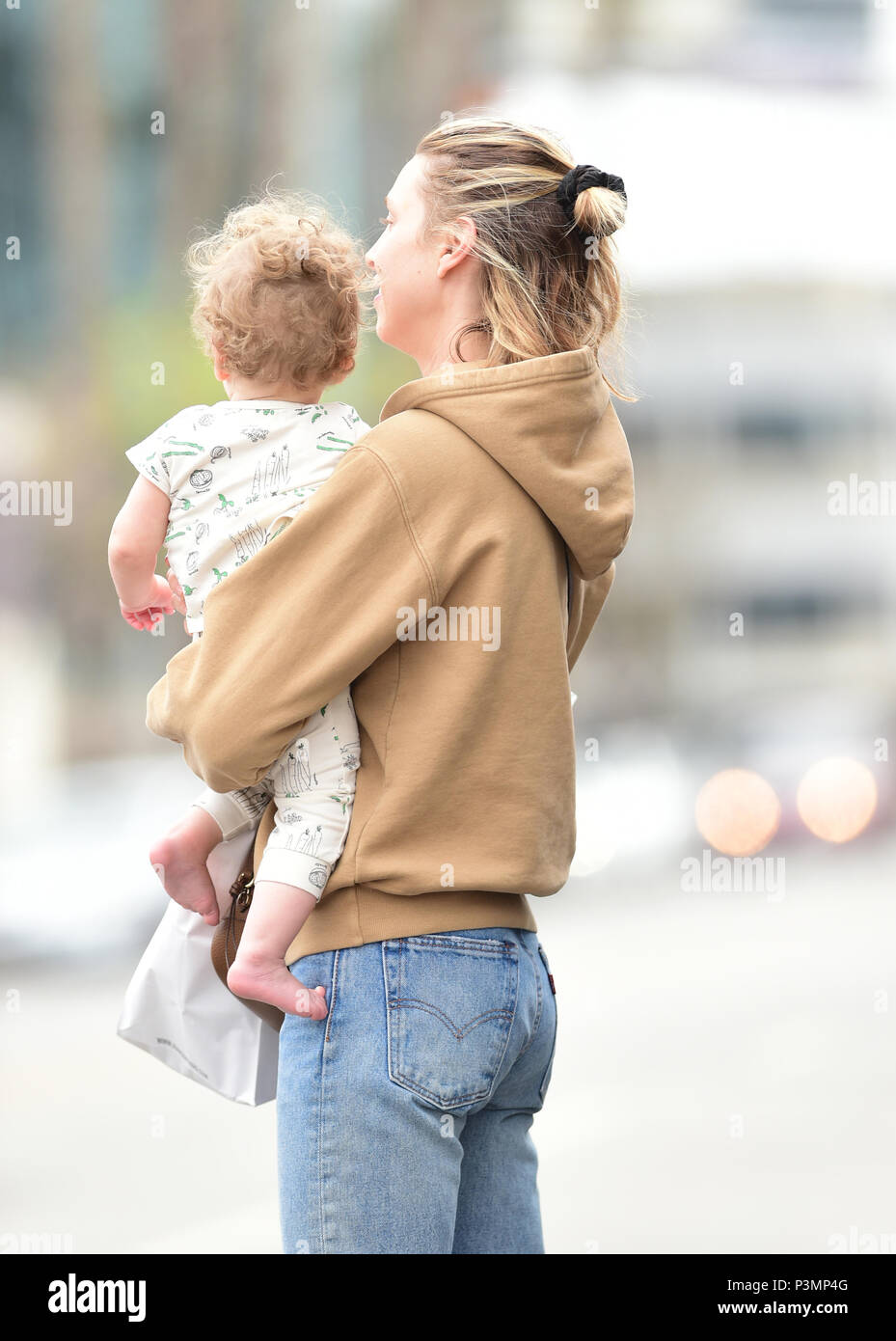 Whitney Port greets her son Sonny after picking up lunch at Joan's on