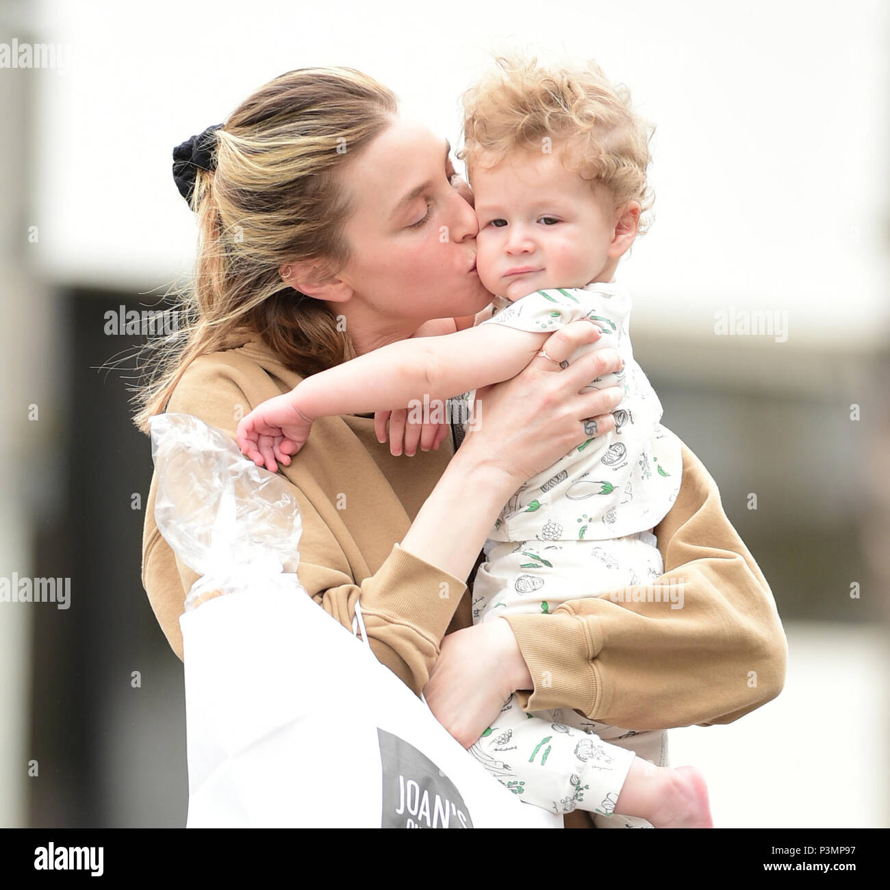 Whitney Port greets her son Sonny after picking up lunch at Joan's on
