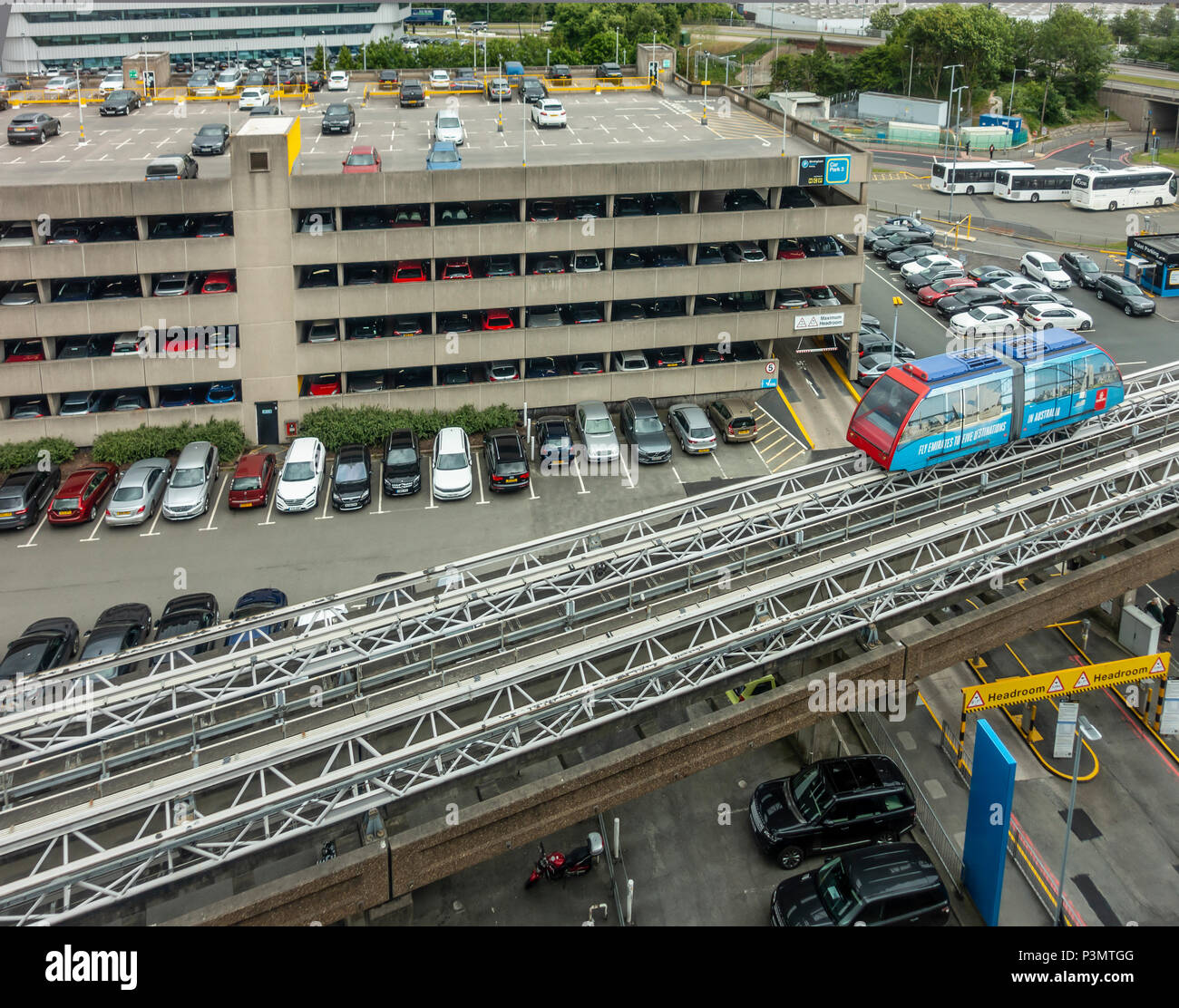 Car Park outside Birmingham Airport, England, UK showing coach park and the automated Air-Link people-mover. Stock Photo