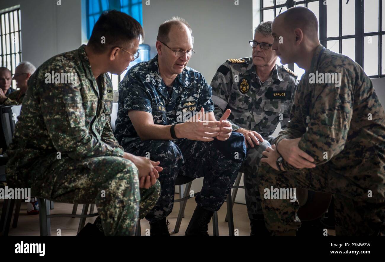 160705-M-TM809-105 LEGAZPI, Philippines (July 05, 2016) U.S. Navy Capt. Tom Williams, mission commander, Pacific Partnership 2016 (center), discusses Humanitarian Assistance Disaster Relief with Filipino representatives during a HADR workshop. During the three-day workshop, co-hosted by the Armed Forces of the Philippines and Pacific Partnership 2016, Filipino civilians and military service members coordinated a tabletop exercise to simulate multilateral disaster response among partners during a crisis. Pacific Partnership is visiting the Philippines for the seventh time since its first visit  Stock Photo