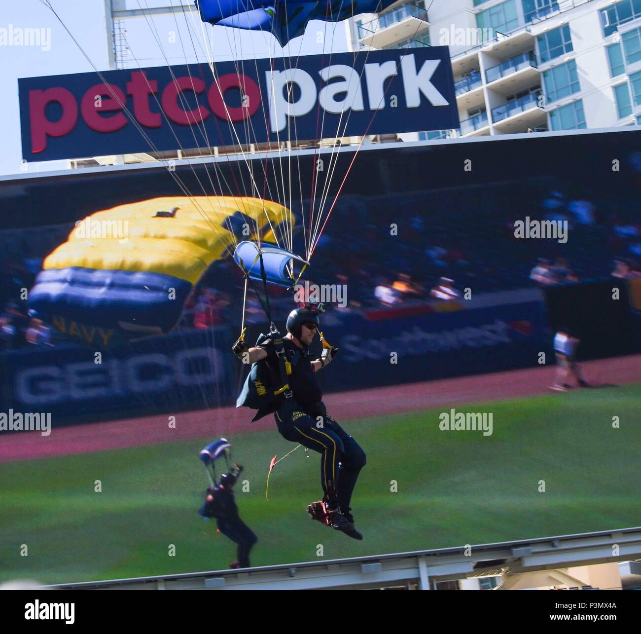 160710-N-VY375-079  SAN DIEGO (July 10, 2016) Retired U.S. Navy SEAL Jim Woods, member of the U.S. Navy Parachute Team, the Leap Frogs, comes in for a landing during a demonstration at the Major League Baseball All-Star Futures Game above Petco Park. The Navy Parachute Team is based in San Diego and performs aerial parachute demonstrations around the nation in support of Naval Special Warfare and Navy recruiting. (U.S. Navy photo by Special Operator 1st Class Remington Peters/Released) Stock Photo