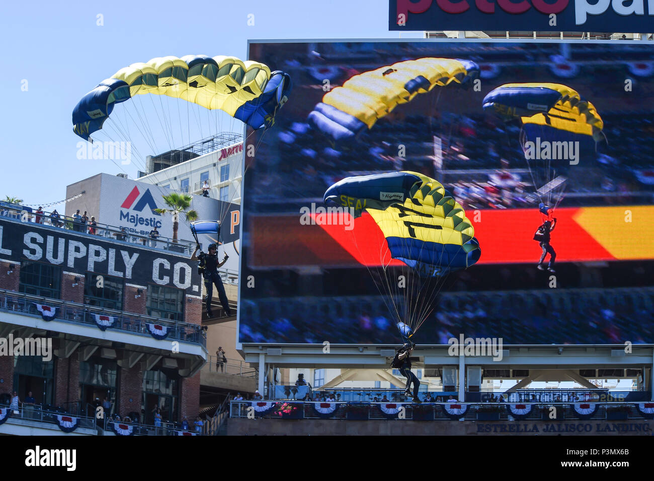 160710-N-VY375-040 SAN DIEGO (July 10, 2016) – Members of the U.S. Navy Parachute Team, the Leap Frogs, prepare to land during a demonstration at the Major League Baseball All-Star Futures Game above Petco Park. The Navy Parachute Team is based in San Diego and performs aerial parachute demonstrations around the nation in support of Naval Special Warfare and Navy recruiting. (U.S. Navy photo by Special Operator 1st Class Remington Peters/Released) Stock Photo