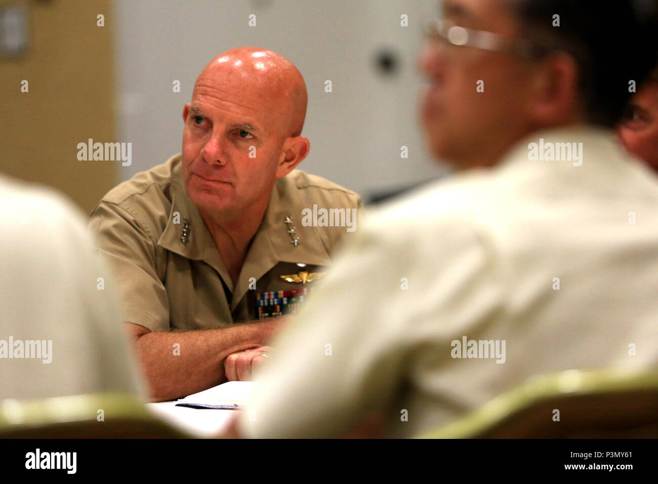 U.S. Marine Corps Lt. Gen. David Berger, commanding general, I Marine Expeditionary Force, meets with representatives from the Japan Ground Self Defense Force at the Pacific Command Amphibious Leaders Symposium 2016 (PALS-16) in San Diego, Calif., July 11, 2016. Twenty-two allied and partnered nations, including the U.S. are participating in PALS-16 to strengthen interoperability and working relationships across a wide range of military operations from disaster relief to complex expeditionary operations. PALS gives leaders the opportunity to discuss key aspects of maritime/amphibious operation Stock Photo