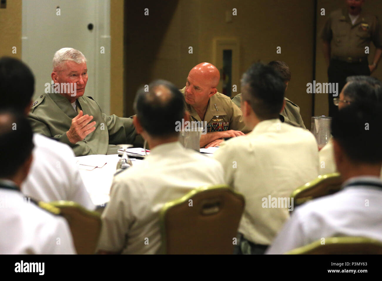U.S. Marine Corps Lt. Gen. John A. Toolan, left, commanding general, Fleet Marine Force, Pacific, and U.S. Marine Corps Lt. Gen. David Berger, right, commanding general, I Marine Expeditionary Force, sit and discuss topics brought up during the Pacific Command Amphibious Leaders Symposium 2016 (PALS-16) in San Diego, Calif., July 11, 2016. The symposium consists of academic discussions, a scenario-based Table-Top Exercise, a sea-basing and amphibious landing demonstration and group discussions. Events such as PALS-16 help to strengthen interoperability and working relationships across a wide r Stock Photo