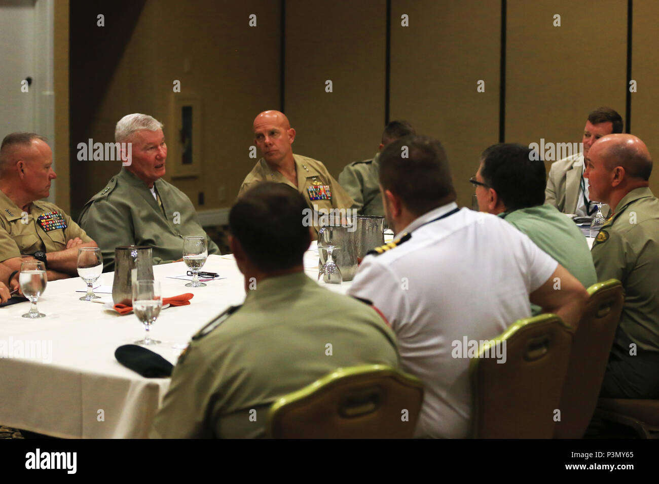 U.S. Marine Corps Lt. Gen. Lawrence Nicholson, left, commanding general, III Marine Expeditionary Force, Lt. Gen. John A. Toolan, middle, commanding general, Fleet Marine Force, Pacific, and Lt. Gen. David Berger, commanding general, I Marine Expeditionary Force, speak with representatives from New Zealand and Australia during the Pacific Command Amphibious Leaders Symposium 2016 (PALS-16) in San Diego, Calif., July 11, 2016. PALS-16 brings together senior leaders of allied and partner nations throughout the Indo-Asia Pacific region to have a meaningful dialogue on key aspects of maritime/amph Stock Photo