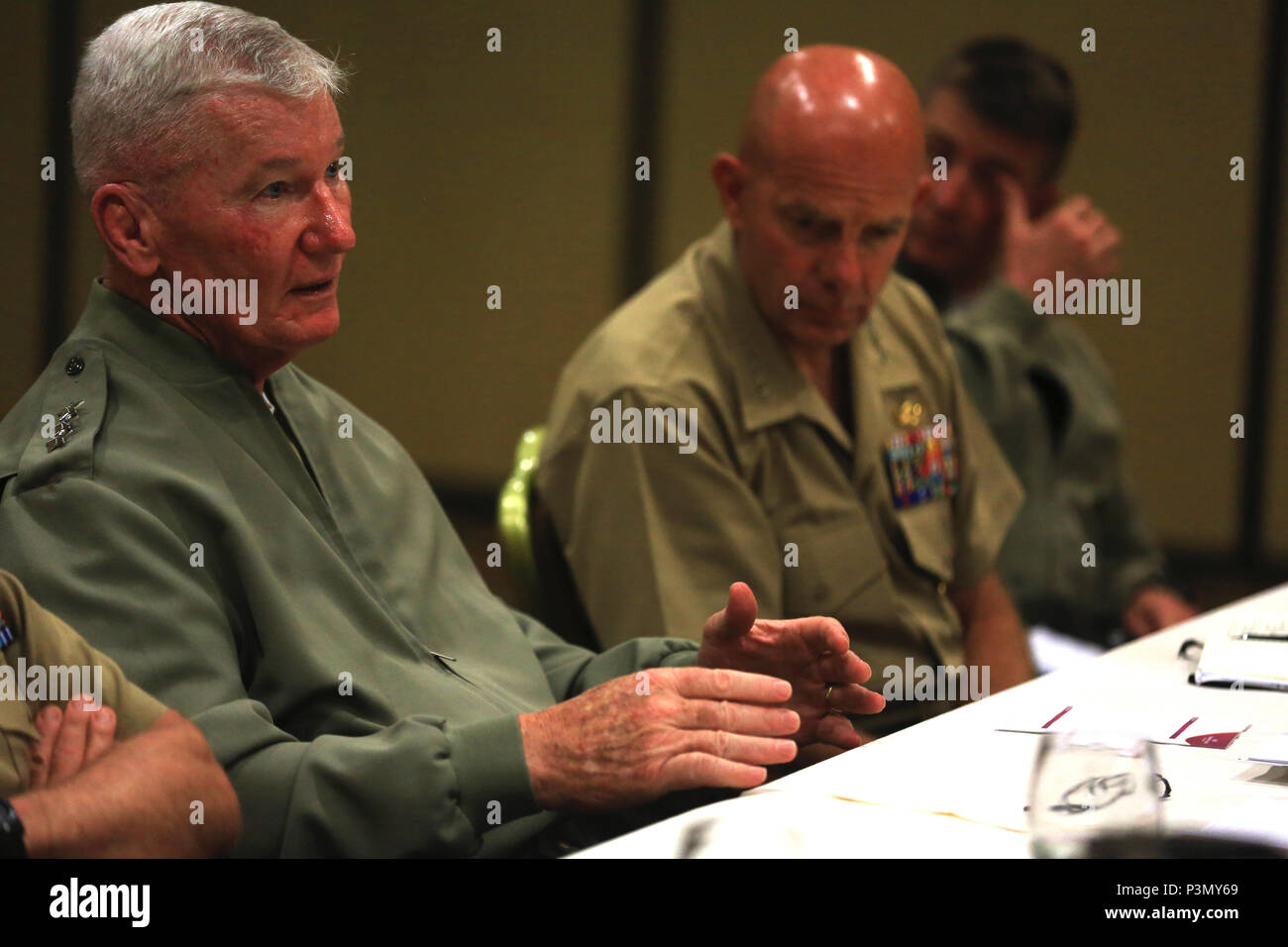 U.S. Marine Corps Lt. Gen. John A. Toolan, left, commanding general, Fleet Marine Force, Pacific, and U.S. Marine Corps Lt. Gen. David Berger, commanding general, I Marine Expeditionary Force, discuss topics from the Pacific Command Amphibious Leaders Symposium 2016 in San Diego, Calif., July 11, 2016. The symposium consists of academic discussions, a scenario-based Table-Top Exercise, a sea-basing and amphibious landing demonstration, and group discussions. Capable maritime/amphibious forces help ensure stability and prosperity around the world, and PALS-16 helps all participants improve thei Stock Photo