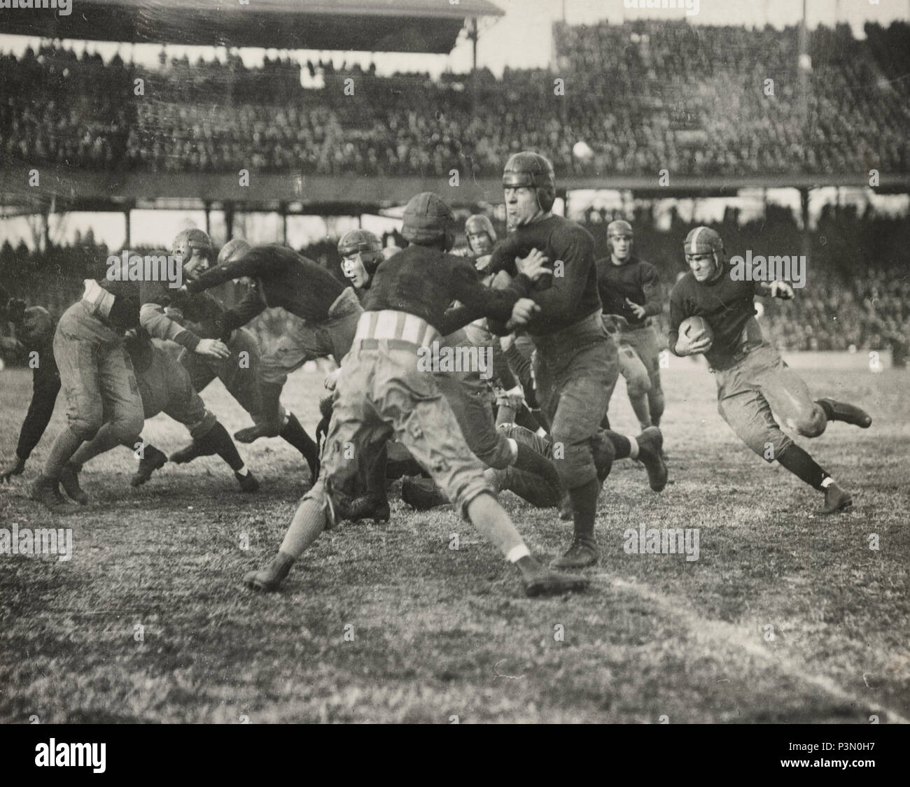 An American Football game, circa 1920 Stock Photo