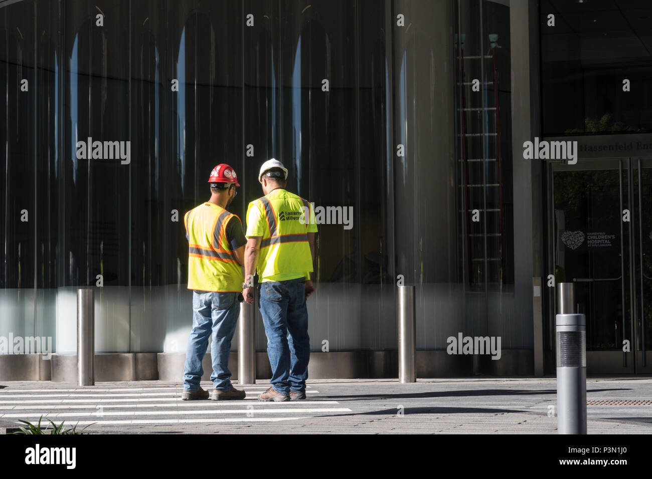 Two construction Workers Meeting on site, NYC, USA Stock Photo