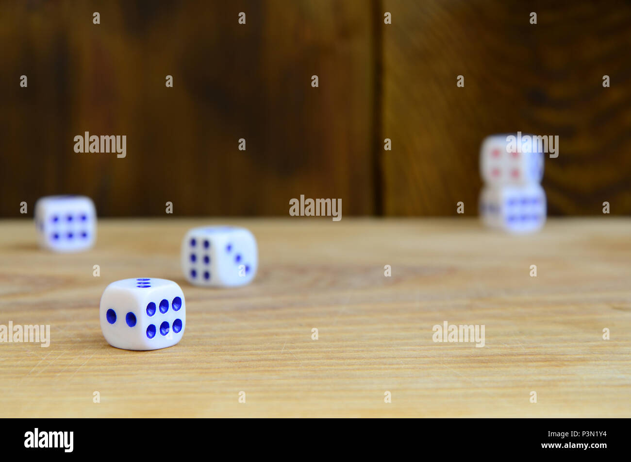 A Few Dice Lies On The Surface Of Natural Wood Items For Generating 