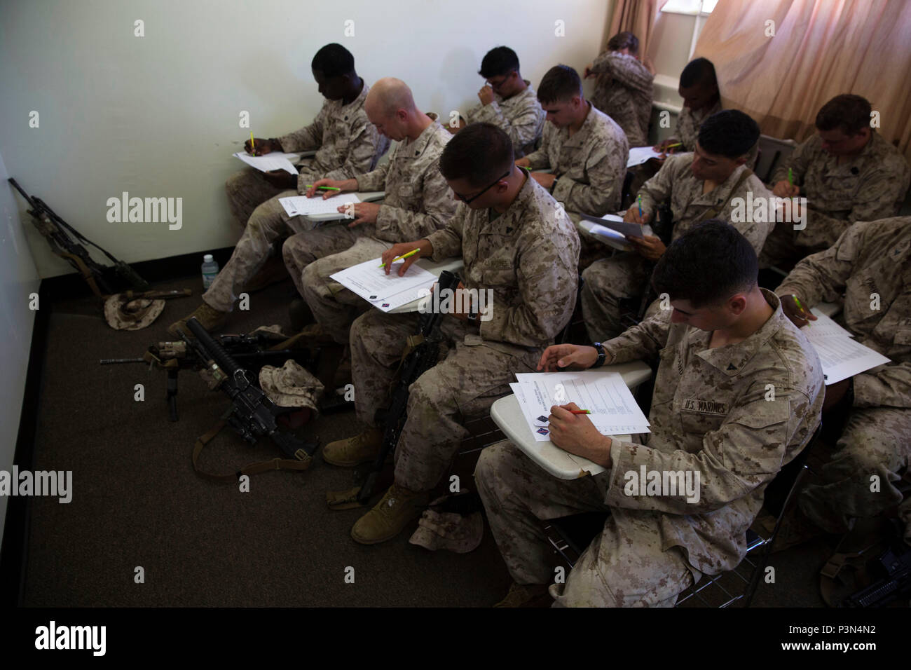 Marines with 5th Marine Regiment, 1st Marine Division take a written
