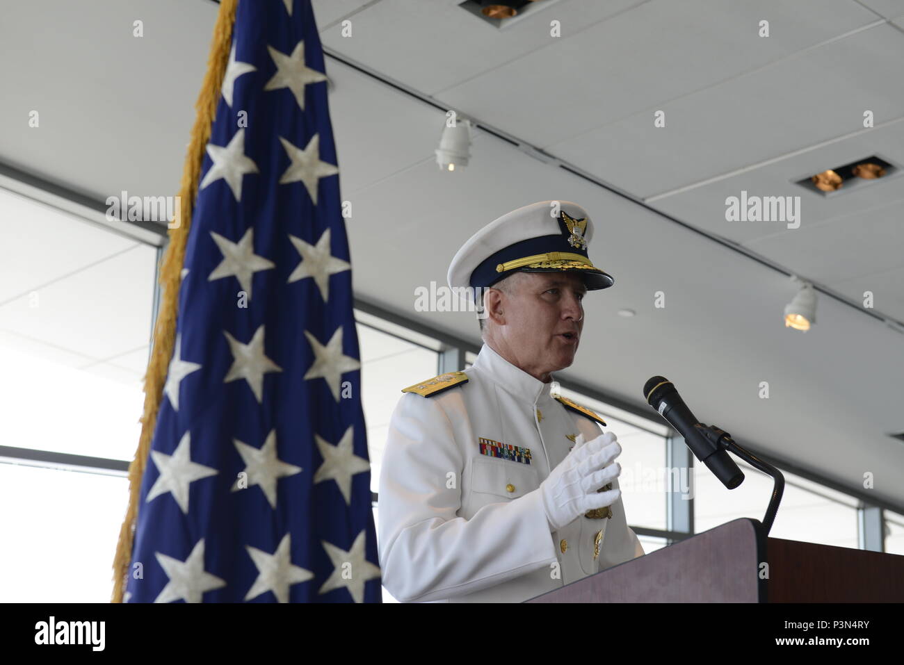 Rear Adm. David R. Callahan, Commander of the Eighth Coast Guard District, addresses attendees during the Coast Guard Sector Ohio Valley official change-of-command ceremony Friday at the Muhammed Ali Center, Louisville, Kentucky. During the ceremony, Capt. Michael B. Zamperini assumed command of Sector Ohio Valley from Capt. Richard V. Timme. U.S. Coast Guard photo by Petty Officer 3rd Class Lora Ratliff Stock Photo