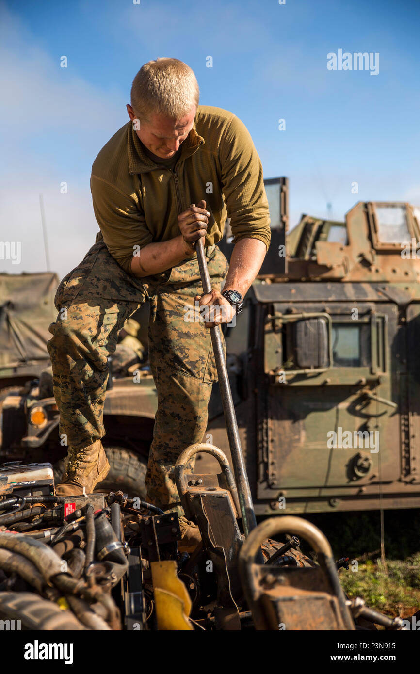 Cpl. Liam D. Fieldsted, an automotive maintenance technician, fixes a humvee during Exercise Hamel at Cultana Training Area, South Australia, Australia, July 8, 2016. Exercise Hamel is a trilateral training exercise with Australian, New Zealand, and U.S. forces to enhance cooperation, trust, and friendship. Fieldsted, from Mariposa, California, is with Headquarters and Service Company, 1st Battalion, 1st Marine Regiment, Marine Rotational Force – Darwin. (U.S. Marine Corps photo by Cpl. Mandaline Hatch/Released) Stock Photo