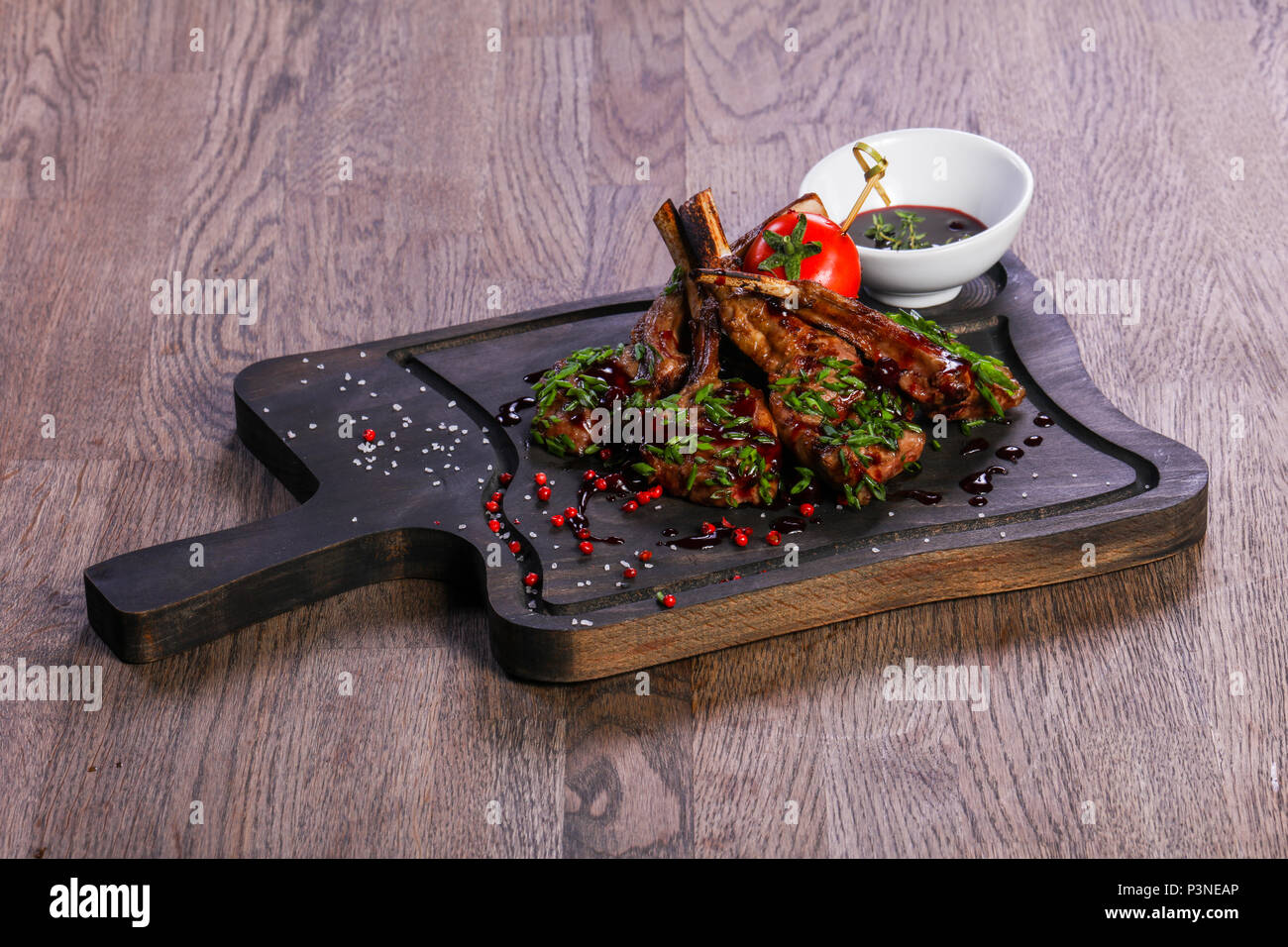 Roasted lamb ribs with sauce Stock Photo - Alamy