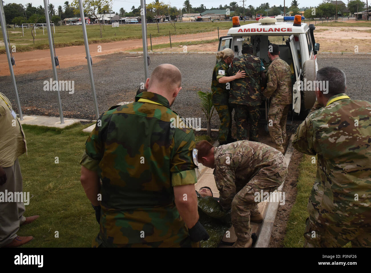 DAR ES SALAAM, Tanzania – Dutch, Ugandan and U.S. Eastern Accord medical personnel transport simulated casualties to an ambulance during a tactical casualty care exercise at the Tanzanian Peacekeeping Training Centre, July 15, 2016, in Dar es Salaam, Tanzania. The medical team supports approximately 200 personnel for the annual, combined, joint military exercise that brings together nine partner nations to practice and demonstrate proficiency in conducting peacekeeping operations. (U.S. Air Force photo by Staff Sgt. Tiffany DeNault) Stock Photo